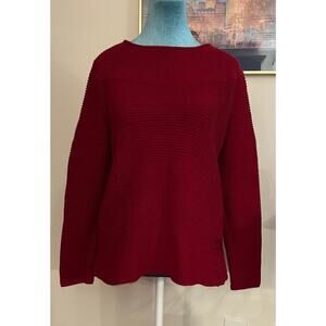 Deep red sweater with button accents on left shoulder